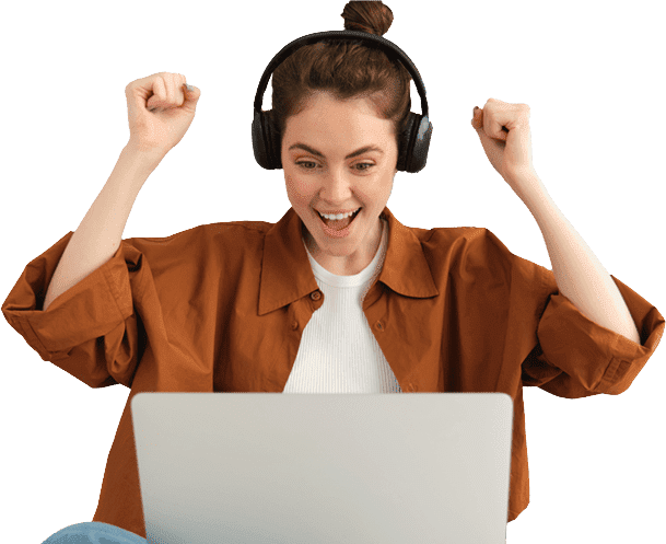 Happy woman on laptop after creating an online training using BlueBird L.M.S.